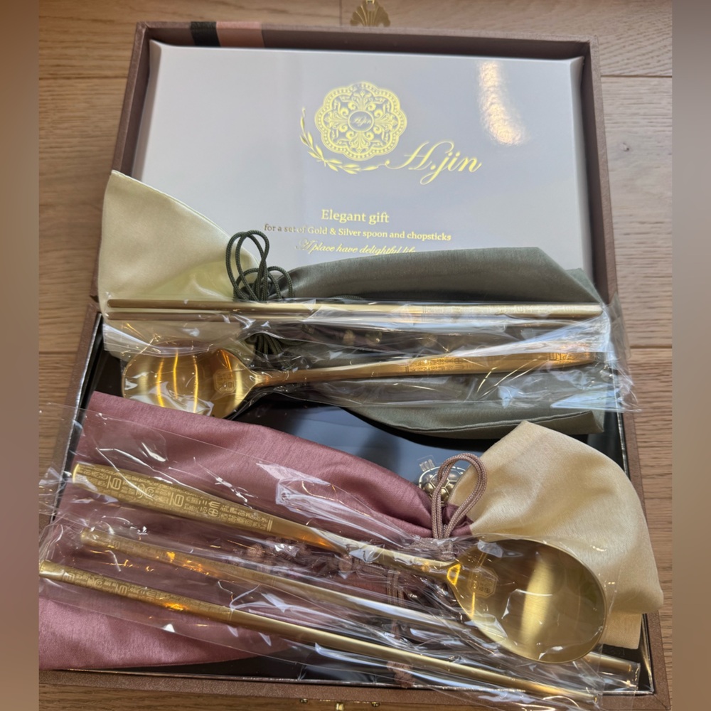 Gold Flatware Set with Green and Pink Accents